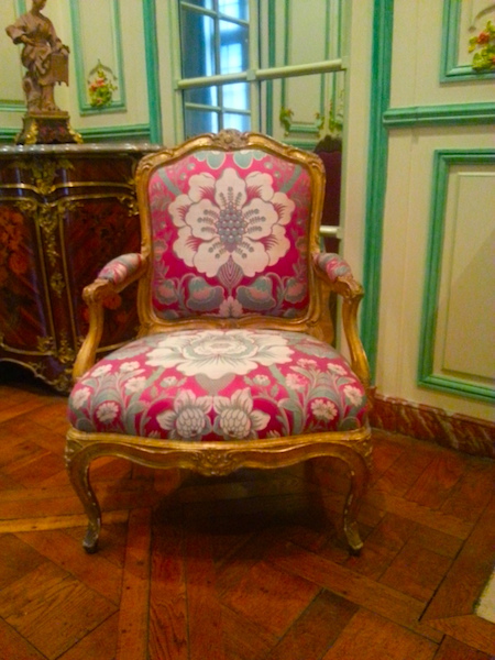 The fauteuil on the left side of the mantel in the 'Green Salon.'