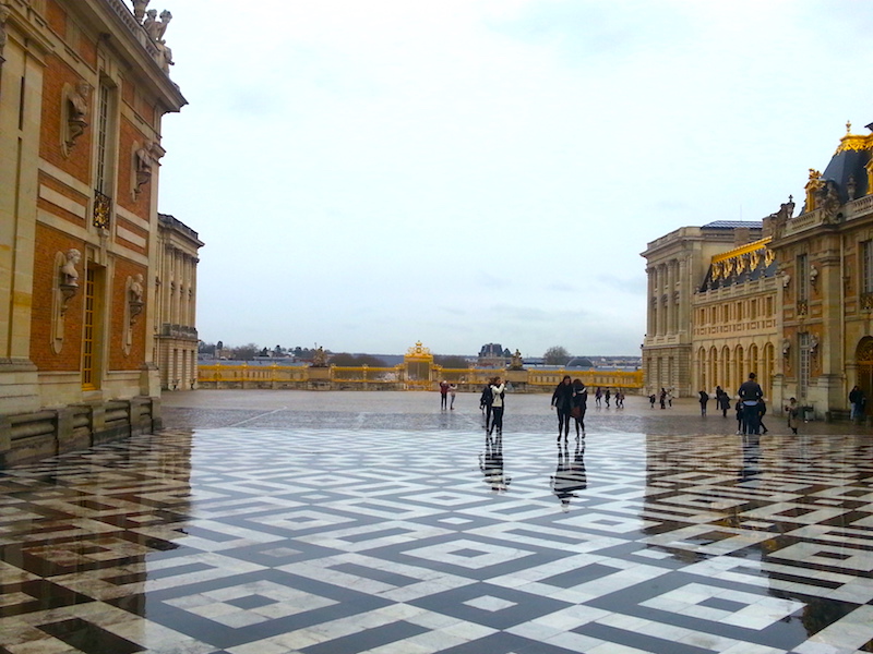 View from the Cour de Marbe into the Cour Royale on a rainy day.
